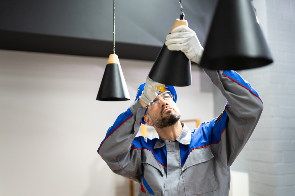 electrician installing hanging pendant lights