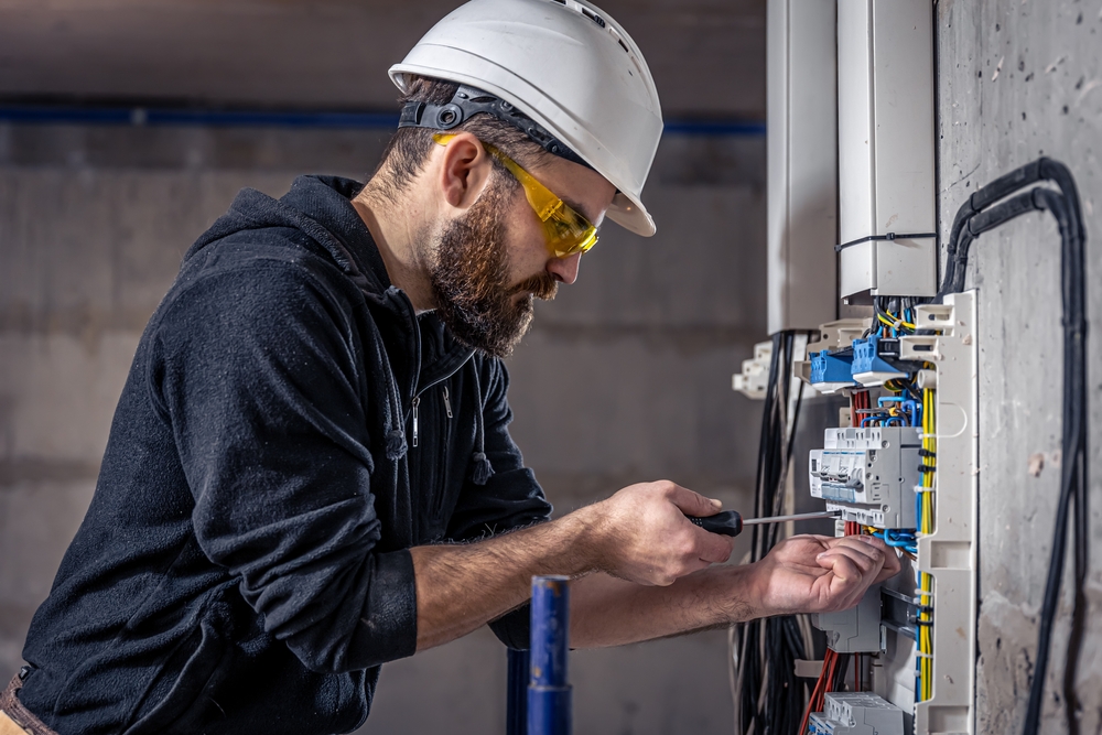 electrician working with electrical devices