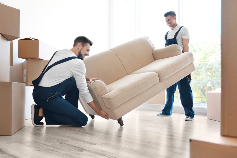 2 movers lifting couch